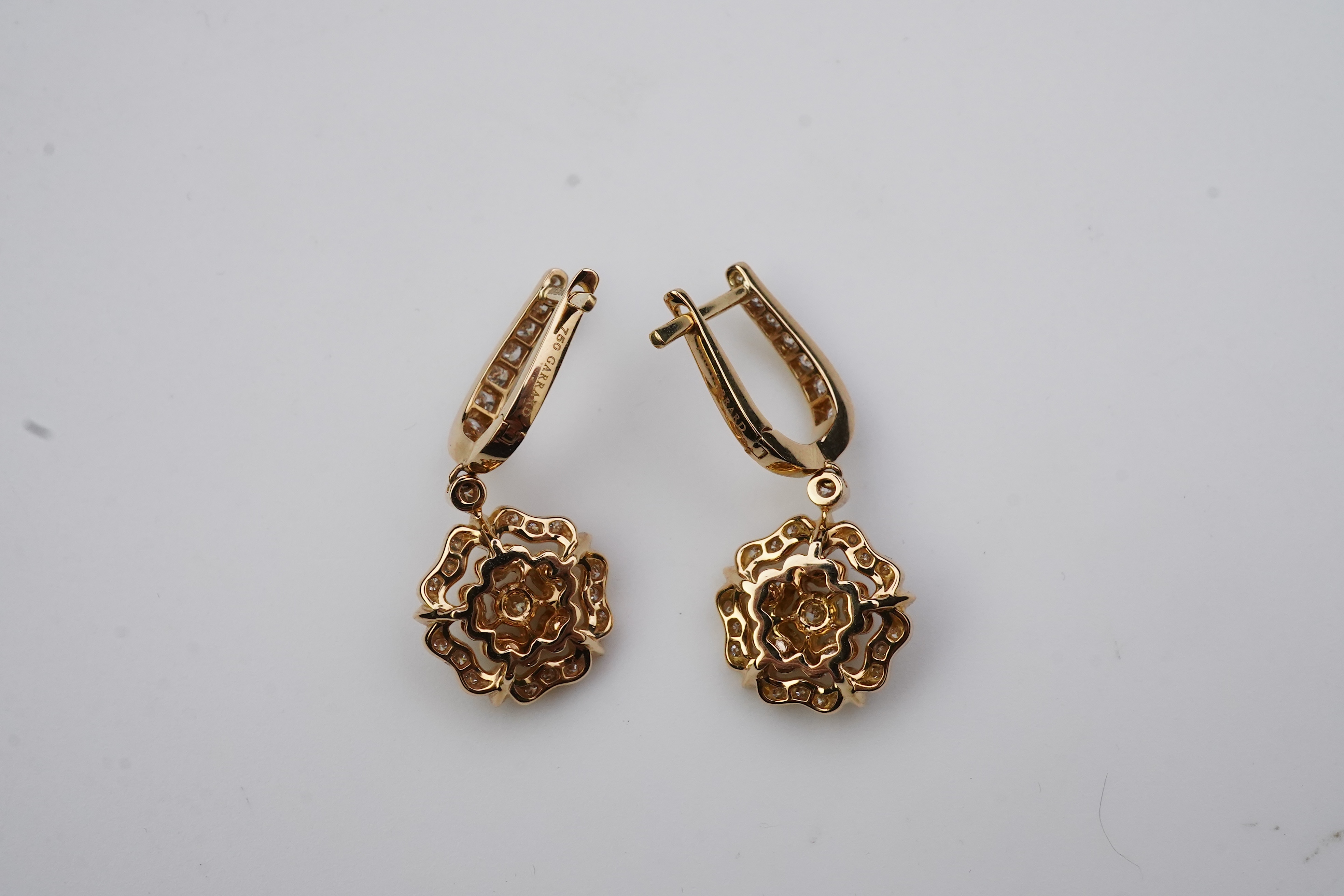 Garrard, a pair of diamond 'Tudor Rose Mini Icon' earrings